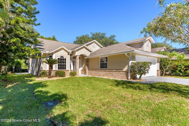 480 Prestwick Ct, Melbourne, FL 32940 - ranch-style house with a garage, concrete driveway, brick siding, and a front yard