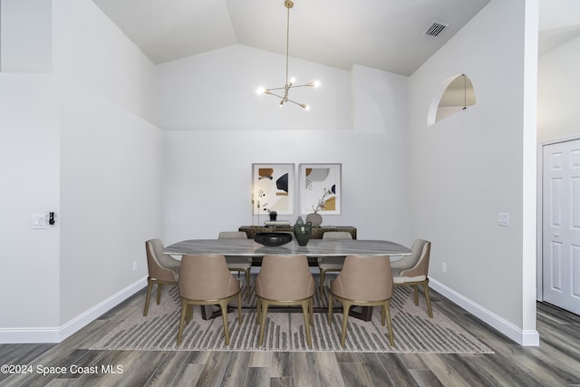 480 Prestwick Ct, Melbourne, FL 32940 - dining area with visible vents, wood finished floors, high vaulted ceiling, baseboards, and an inviting chandelier