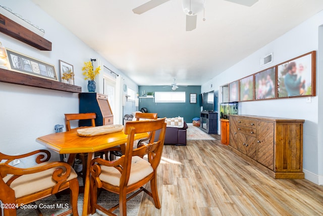 dining area featuring light wood-type flooring