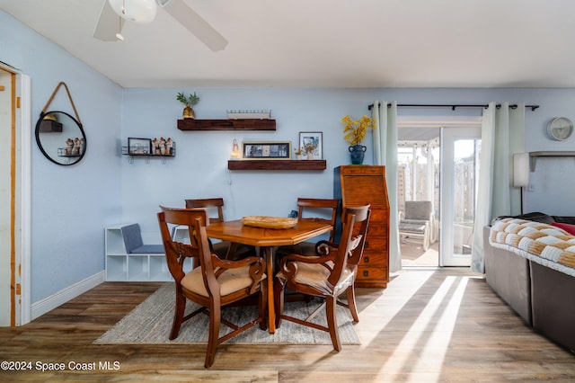 dining space featuring hardwood / wood-style flooring and ceiling fan