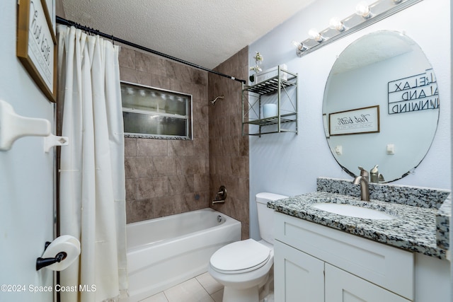 full bathroom featuring tile patterned floors, shower / bath combination with curtain, a textured ceiling, toilet, and vanity