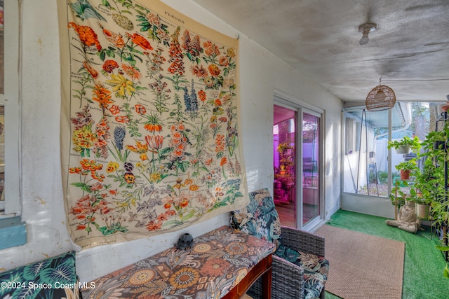 interior space with carpet flooring and a textured ceiling