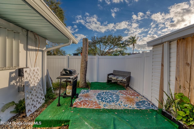 view of patio with a grill