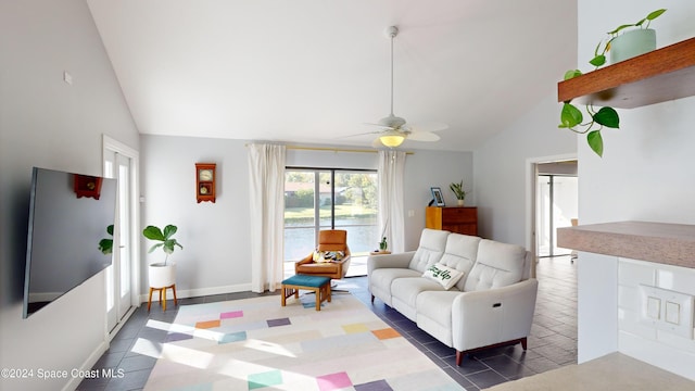 living room featuring ceiling fan and high vaulted ceiling