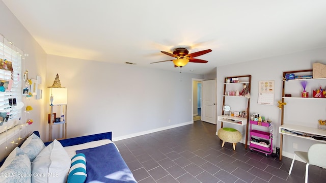 interior space with ceiling fan