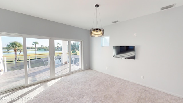 unfurnished living room featuring carpet flooring