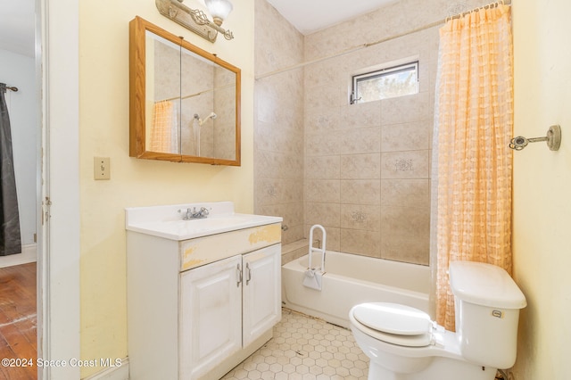 full bathroom featuring toilet, shower / bath combo, and vanity