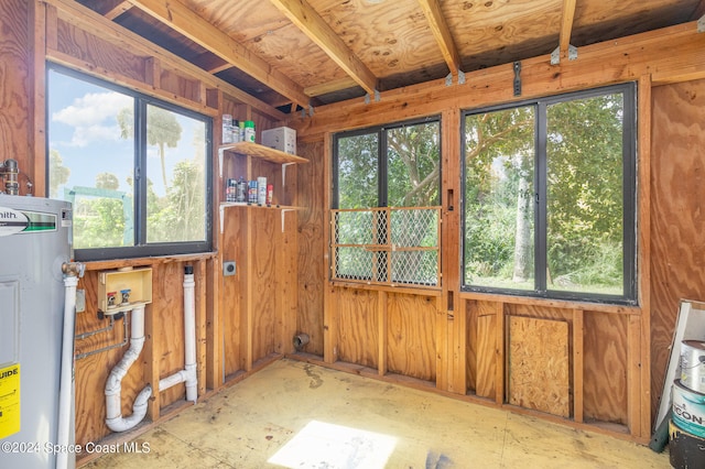 misc room with electric water heater and a wealth of natural light