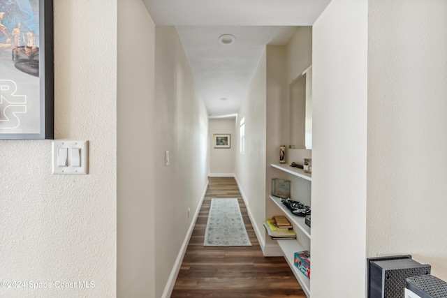 hallway featuring dark wood-type flooring