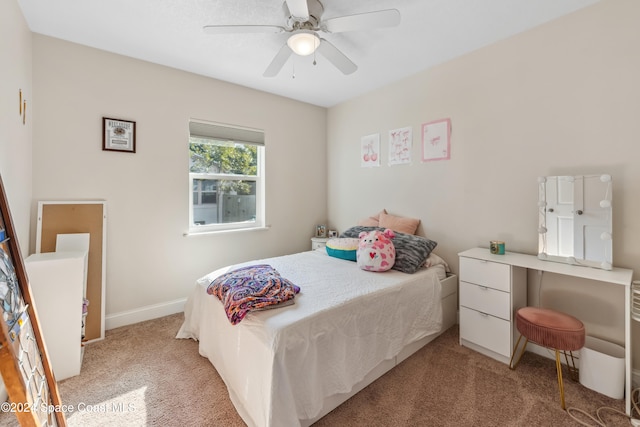 bedroom with light carpet and ceiling fan