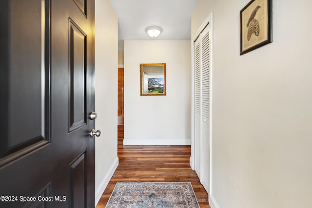 hall with dark hardwood / wood-style floors