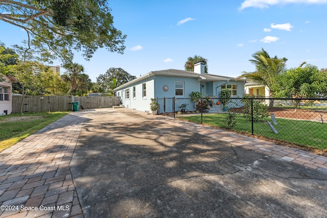 view of front of property with a front lawn