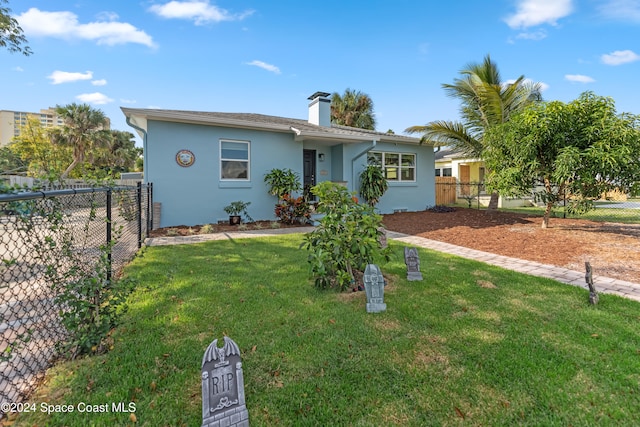 ranch-style home with a front yard