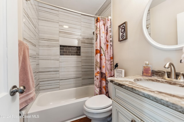 full bathroom with toilet, shower / tub combo with curtain, and vanity