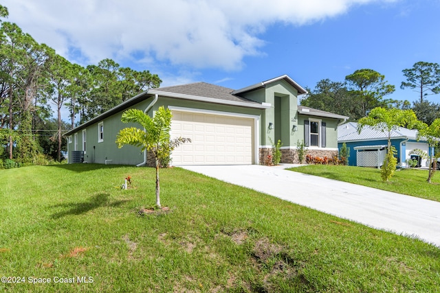 ranch-style home featuring a front yard, a garage, and cooling unit