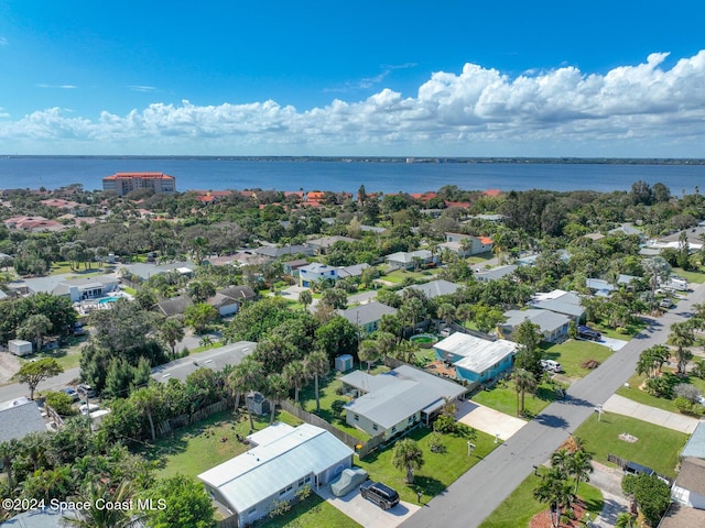 185 Richards Rd, Melbourne Beach, FL 32951 - aerial perspective of suburban area featuring a large body of water