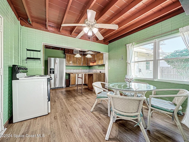 185 Richards Rd, Melbourne Beach, FL 32951 - dining area with wooden ceiling with exposed beams, light wood-style floors, and ceiling fan