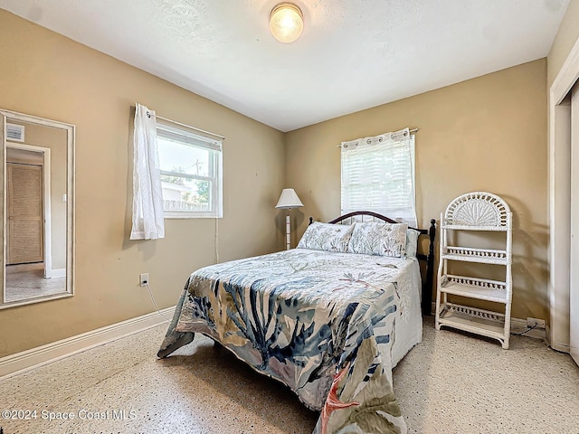 185 Richards Rd, Melbourne Beach, FL 32951 - bedroom featuring baseboards and speckled floor