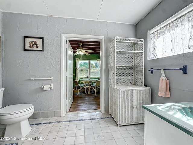 bathroom featuring vanity, tile patterned floors, toilet, and ceiling fan