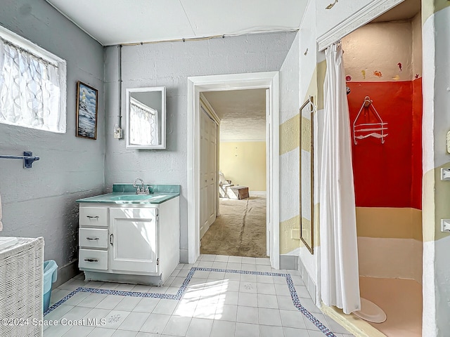 bathroom featuring vanity, a shower with shower curtain, and tile patterned flooring