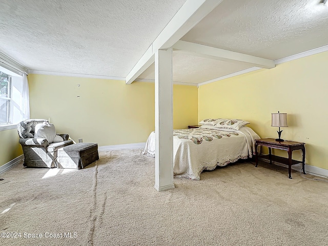 carpeted bedroom with ornamental molding, beam ceiling, and a textured ceiling