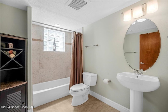 bathroom featuring shower / bath combination with curtain and toilet