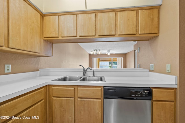 kitchen featuring sink, dishwasher, and a chandelier