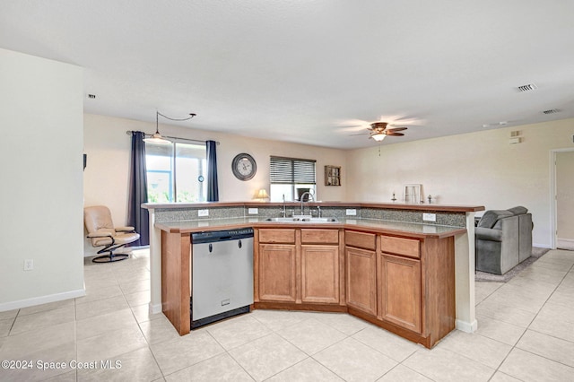 kitchen with a center island with sink, sink, light tile patterned floors, stainless steel dishwasher, and ceiling fan