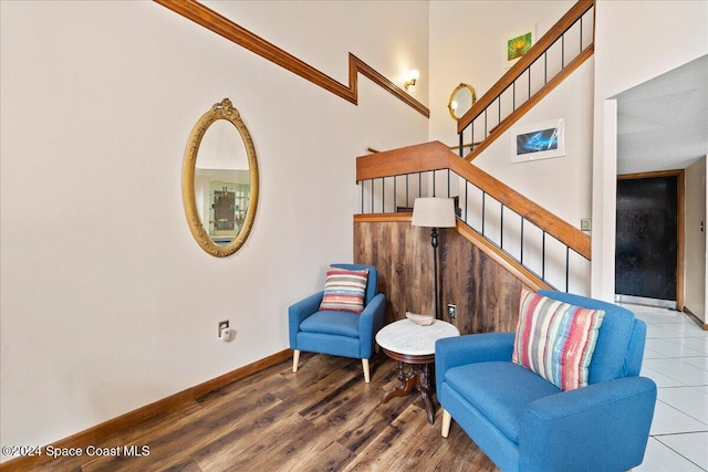 sitting room featuring crown molding and hardwood / wood-style flooring