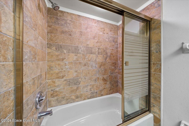 bathroom with enclosed tub / shower combo and ornamental molding