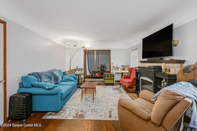 415 Audubon Dr, Melbourne, FL 32901 - living room with wood finished floors and a fireplace
