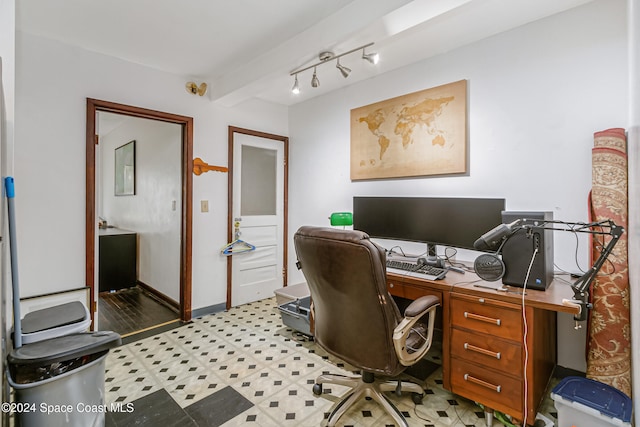 office space featuring light hardwood / wood-style floors and beam ceiling