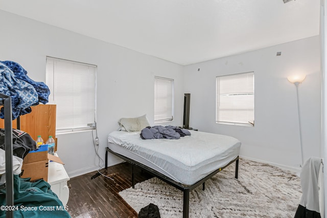 bedroom featuring dark hardwood / wood-style flooring