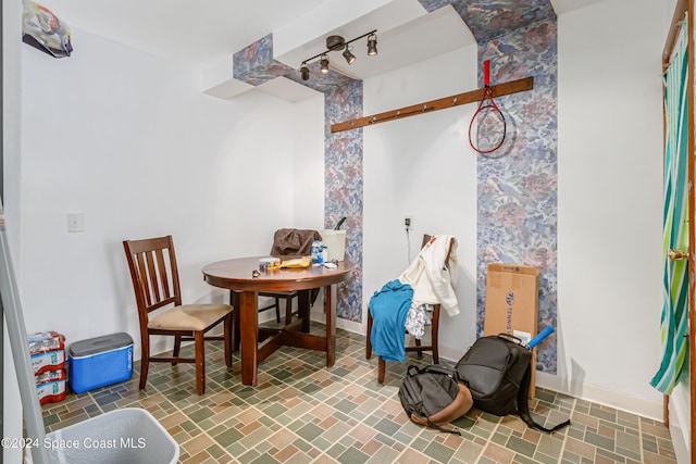 415 Audubon Dr, Melbourne, FL 32901 - dining area featuring baseboards and track lighting