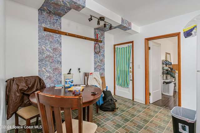 415 Audubon Dr, Melbourne, FL 32901 - dining area featuring baseboards and brick patterned floors