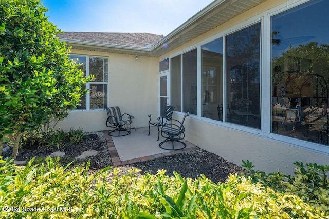 view of patio / terrace with a sunroom