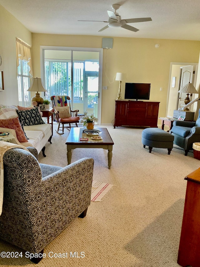 living room with carpet floors and ceiling fan