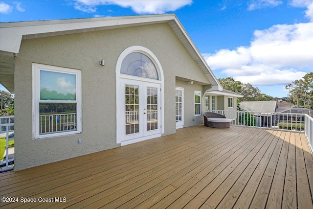 wooden deck featuring french doors