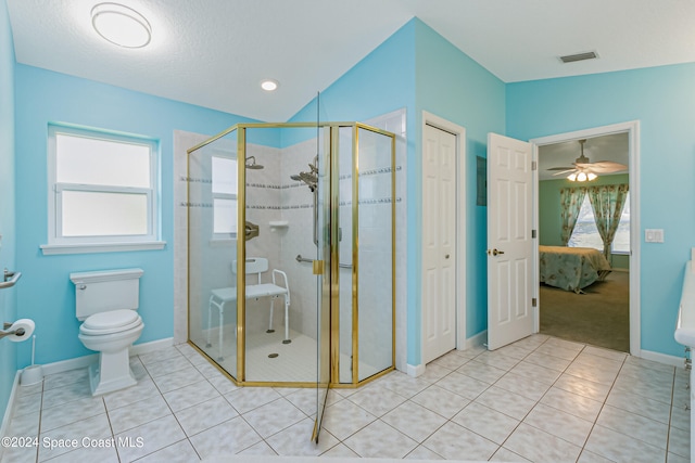 bathroom featuring toilet, tile patterned floors, walk in shower, and ceiling fan