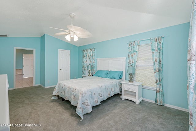 carpeted bedroom featuring lofted ceiling and ceiling fan