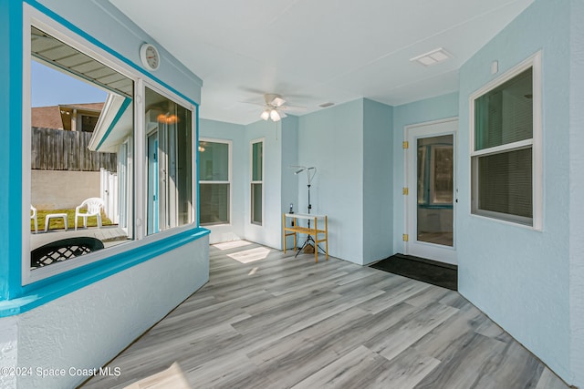 interior space featuring ceiling fan