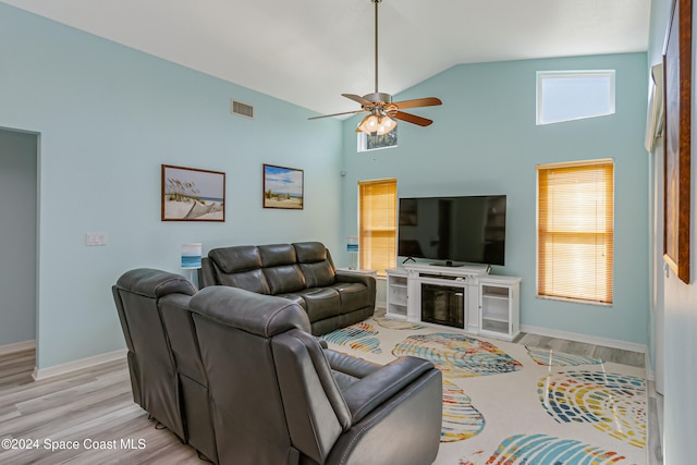 living room with high vaulted ceiling, light wood-type flooring, and ceiling fan