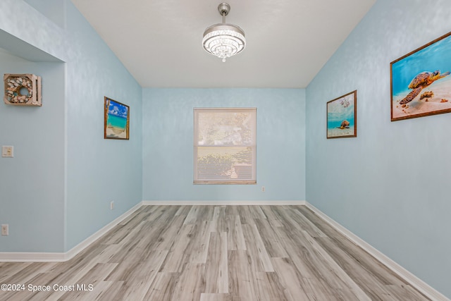 spare room featuring light wood-type flooring