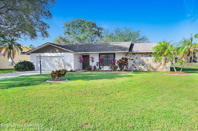 ranch-style house with a garage and a front lawn