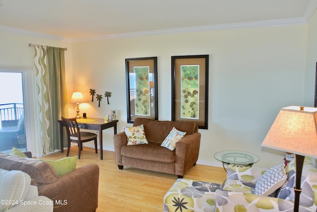 living room featuring light wood-type flooring and crown molding
