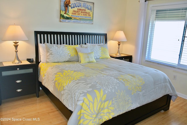 bedroom with hardwood / wood-style floors