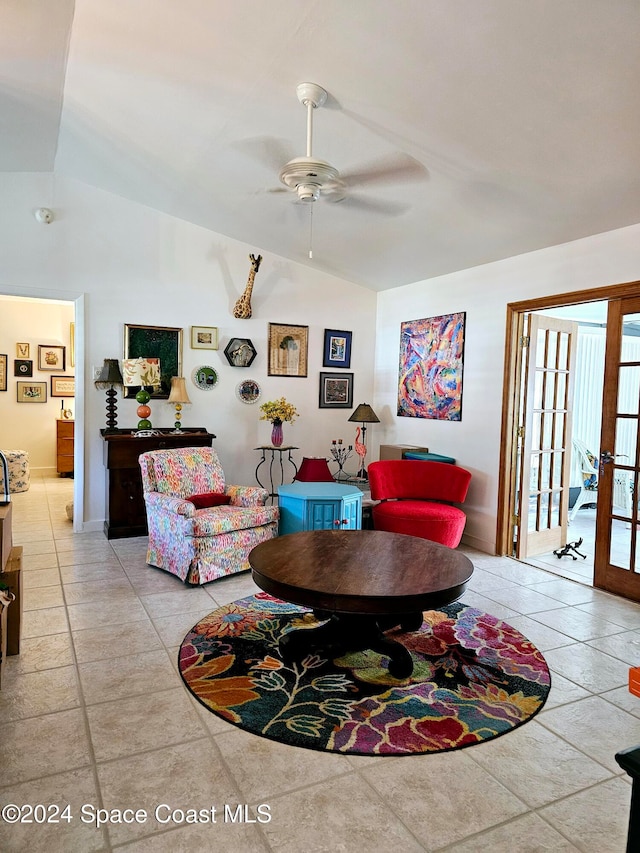 living room featuring ceiling fan, lofted ceiling, and french doors