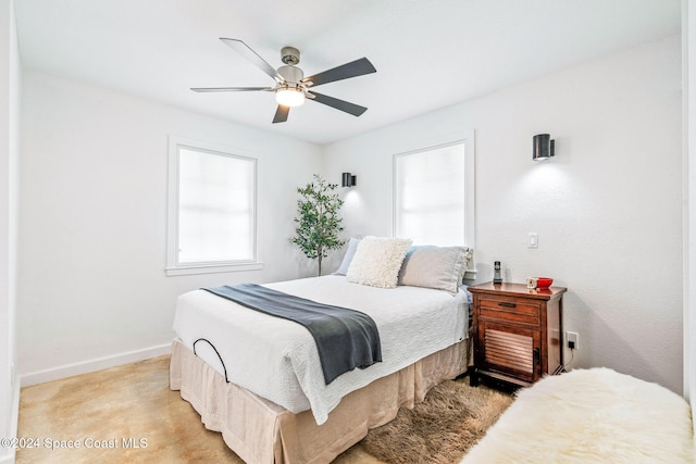 bedroom with light colored carpet and ceiling fan