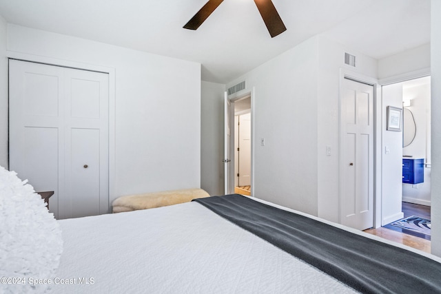 bedroom featuring hardwood / wood-style flooring, a closet, and ceiling fan