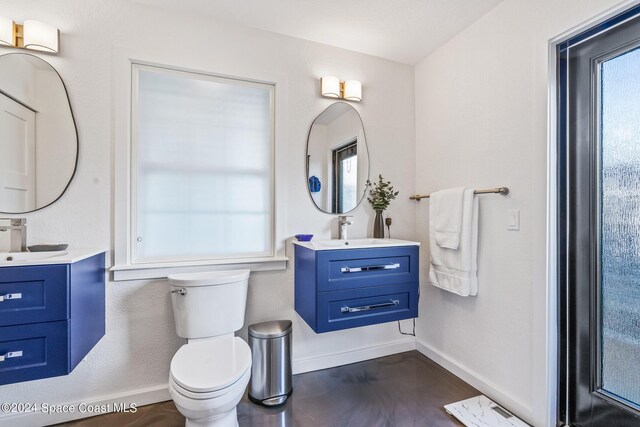 154 21st St SW, Vero Beach, FL 32962 - full bath with baseboards, toilet, and a sink